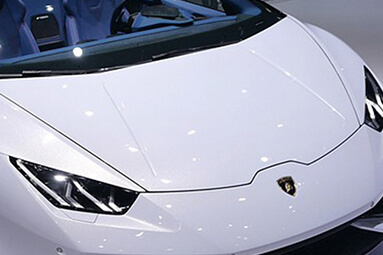 White Lamborghini Aventador parked in exhibition display with top down