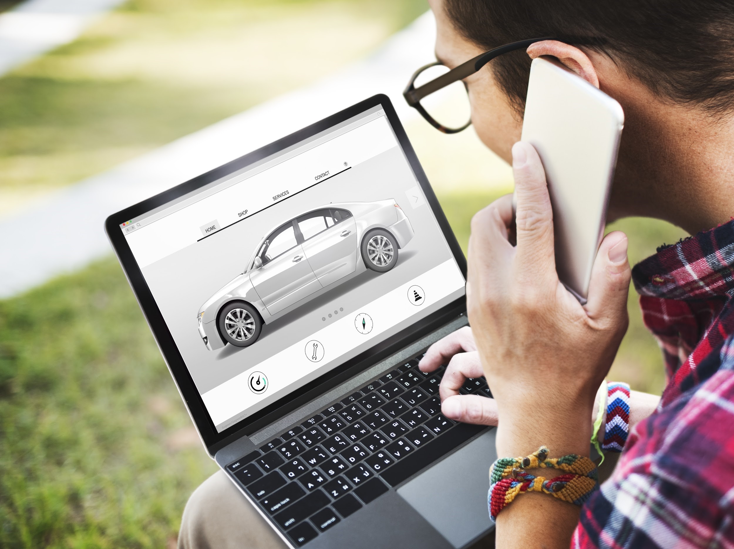 A man looking for car insurance on a laptop