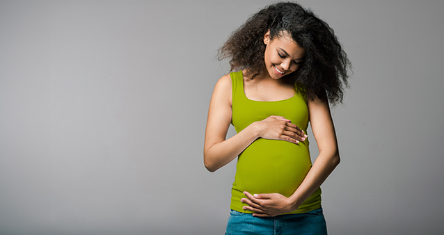 Her joyful expression, gentle and tenderness of impending motherhood. Emphasizing the beauty of this precious moment.