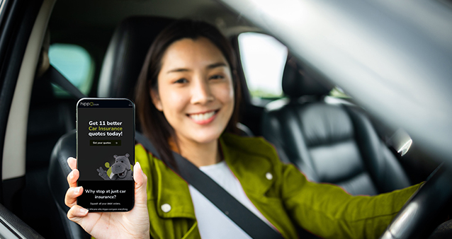 Smiling woman using mobile app to get new car insurance