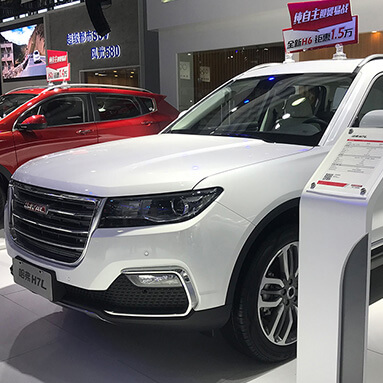 Side front view of the Haval H7 in a showroom.