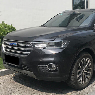 Front side view of a grey Haval H6.