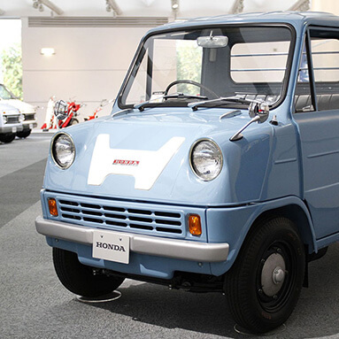 Baby blue classic Honda pickup on display