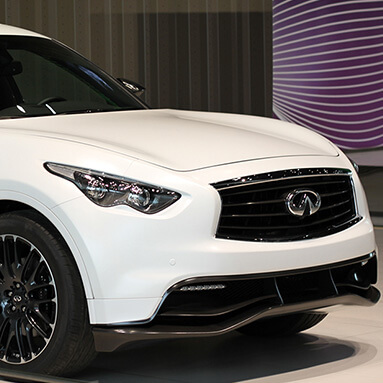 Front side view of a white Infiniti FX Sebastian Vettel.