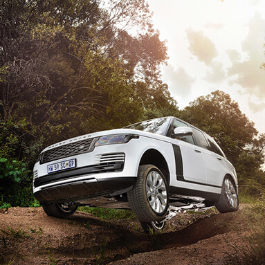 White Range Rover on an off-road course