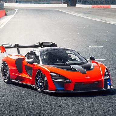 Deep orange McLaren Senna on the race course