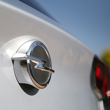 Close-up of Opel logo on a white car
