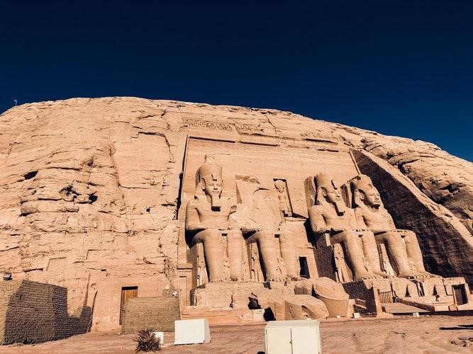 Egyptian burial site with statues outside