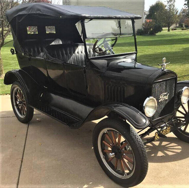 Front side view of a black 1924 Ford Model T.