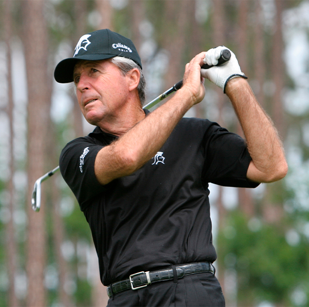 Gary Player playing golf and following through with driver after shot.