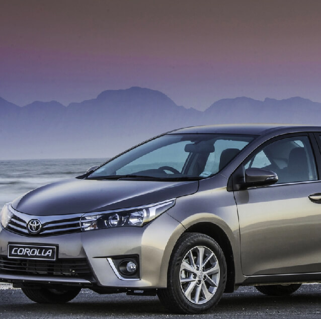 Front side view of a silver Toyota Corolla.