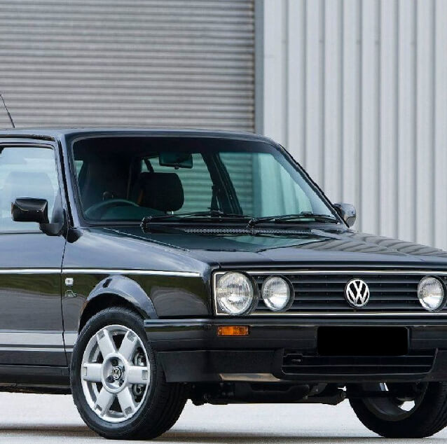 Front side view of a black VW golf.