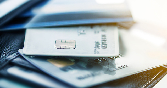 Stack of debit cards from the cheapest bank accounts available in South Africa