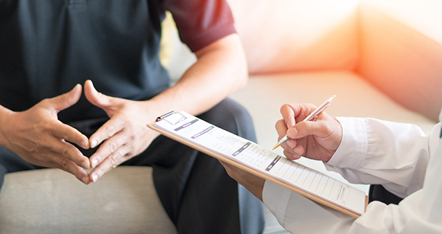 Man consulting doctor, to understand updates to his medical aid in 2021