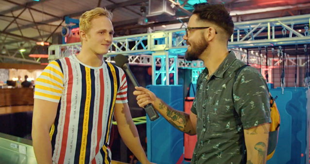 Hippo interviewer poses questions to a man in a striped shirt 