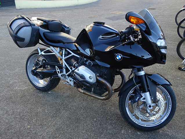 Side view of a black BMW motorbike.