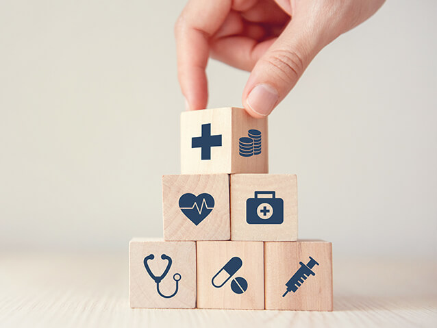 Building blocks with medical icons on them