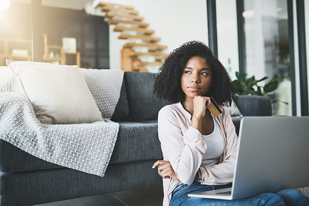 Women sitting infront of laptop wondering how the COVID-19 pandemic and lockdown shapes Buying Habits