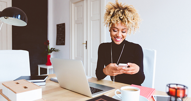 Woman sitting at a desk working from home during lockdown