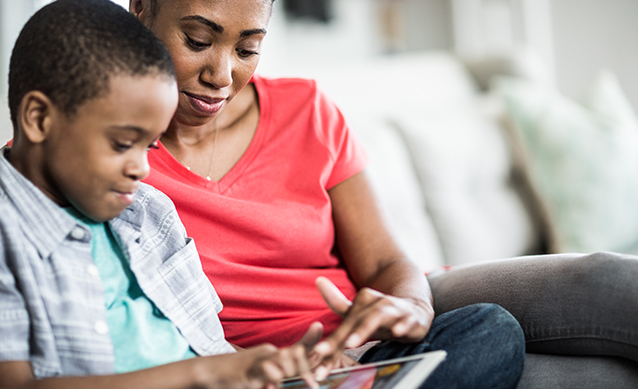 Mother and child on a tablet to find online activities to do during lockdown