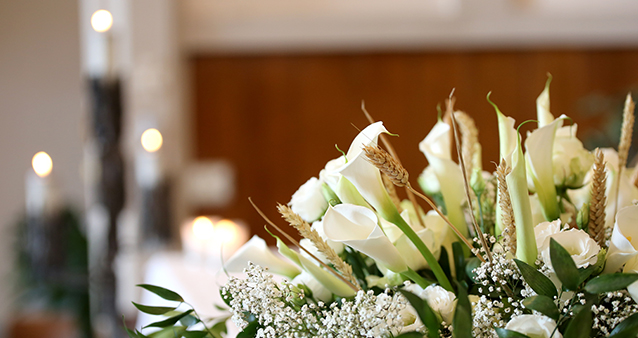 Flowers at funeral service, paid for with the help of funeral cover