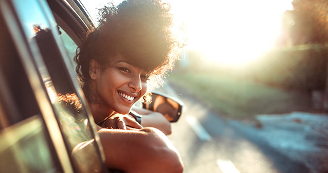 woman on a road-trip with car insurance that is suitable for lots of driving.