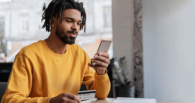 a man learning by reading on his cellphone how virtual banking is safe to use