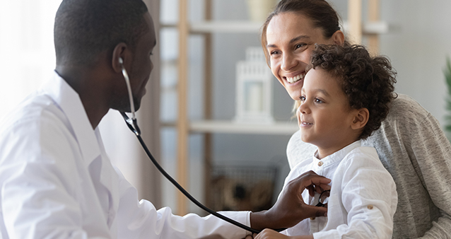 Doctor performs a health check on a child