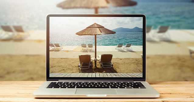 Booking local getaways online using laptop