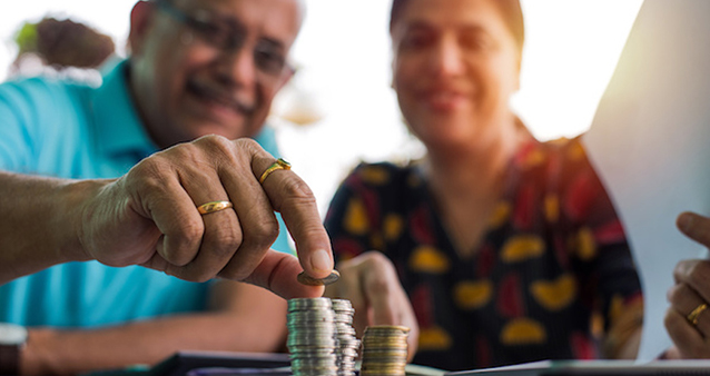 Old man sits thinking about retirement savings