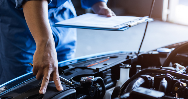 a mechanic fixes a car using cheaper spare parts thanks to new car regulations