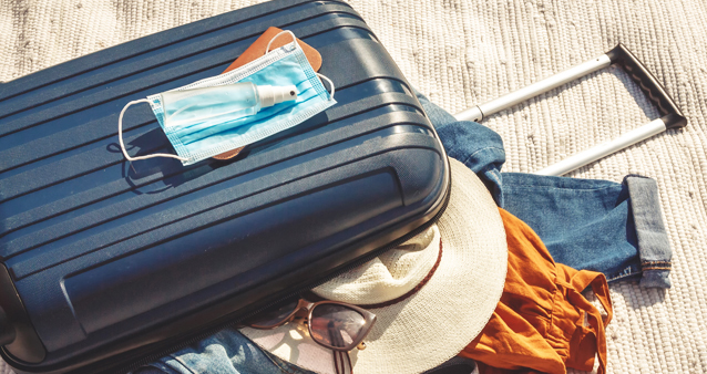 traveller's luggage showing that medical aid will cover you when travelling during lockdown