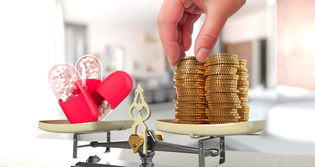 A person compares medical aids by weighing up coins and medication on a scale