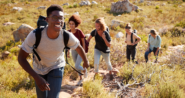 A group of young adults hiking out and about in nature