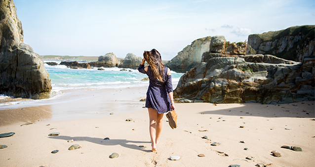 woman walking on an empty beach