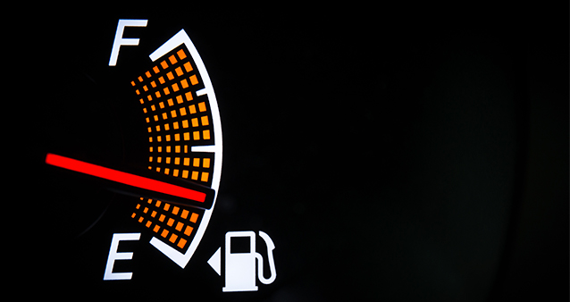 a vehicle's fuel gauge marking a quarter full