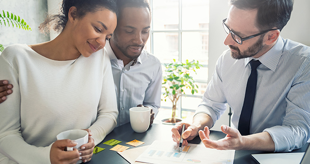 broker discussing life insurance with couple