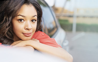 Woman in car staring out 
