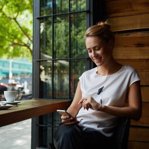 Woman on cellphone in restaurant