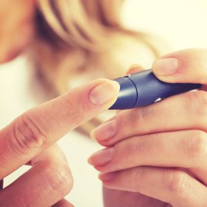 Woman testing diabetes injection 