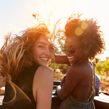 2 girls smiling looking back towards the camera | Product offering | Hippo.co.za partner