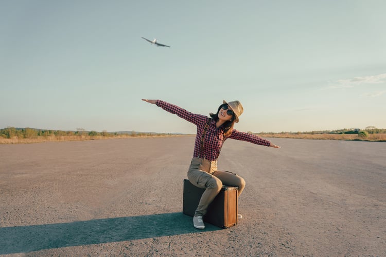 Woman in front of aircraft 