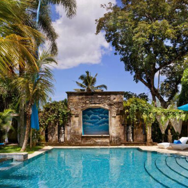 Trees and loungers by the swimming pool