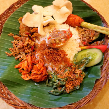 A plate of Nasi Padang, steamed rice served with various vegetables