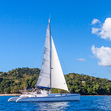 White yacht on bright blue water.