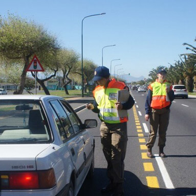 Traffic police officers stopping vehicles on the road