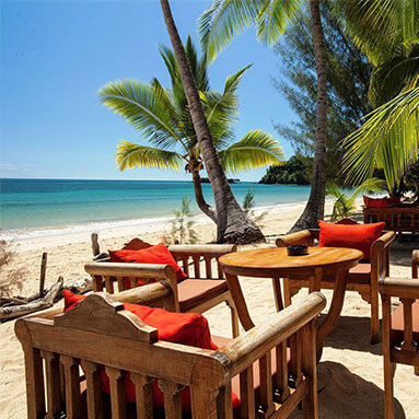 Lounging chairs overlooking the beach at Amarina Resort, Madagascar.
