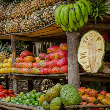Tropical fruits on display at a street stall.