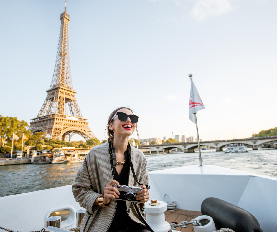 People cycling on the street with buildings in the background.