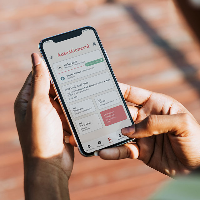 Mobile phone in hand displaying mobile app | road assist | Hippo.co.za partner Mobile phone in hand displaying mobile app | road assist | Hippo.co.za partner
